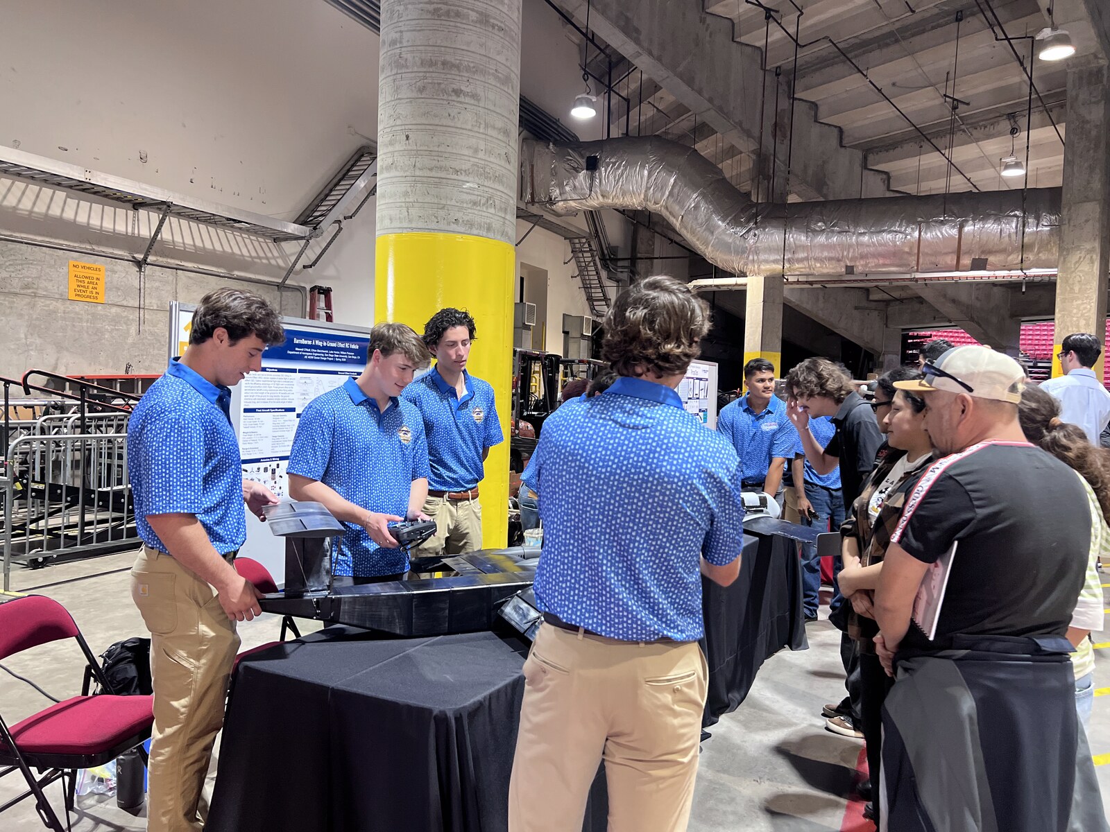 The team showcasing BarrelBorne to attendees at SDSU Senior Design Day, with the project poster visible behind them.